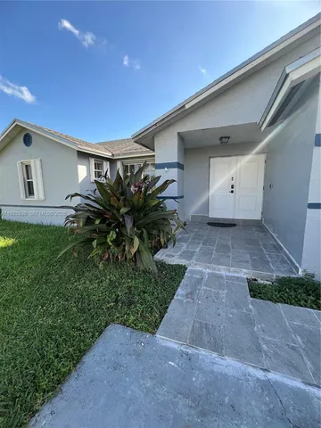 a house view with a garden space