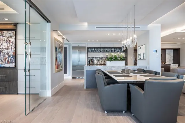 a kitchen with cabinets a counter top space and stainless steel appliances