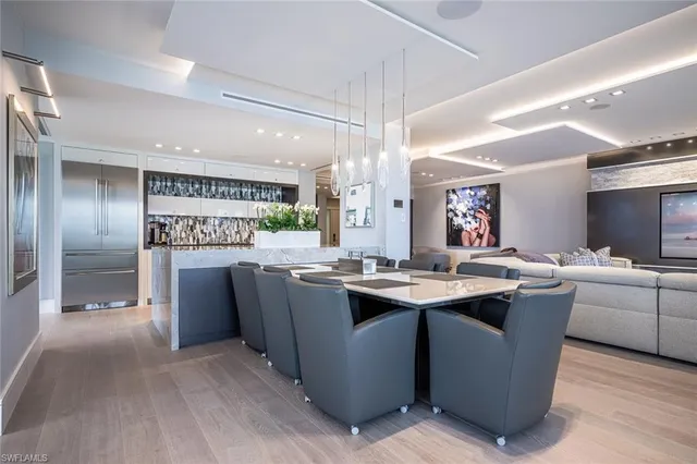 a view of a hallway and a livingroom with furniture