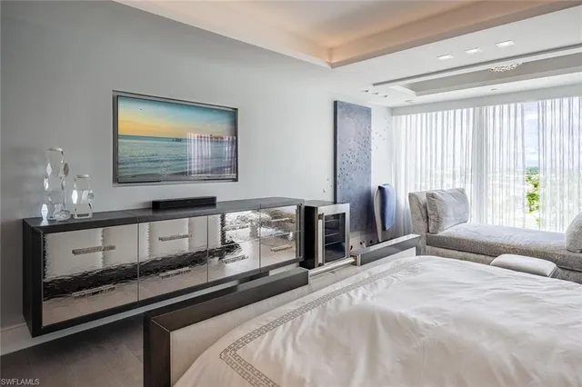 a bedroom with bed and a window