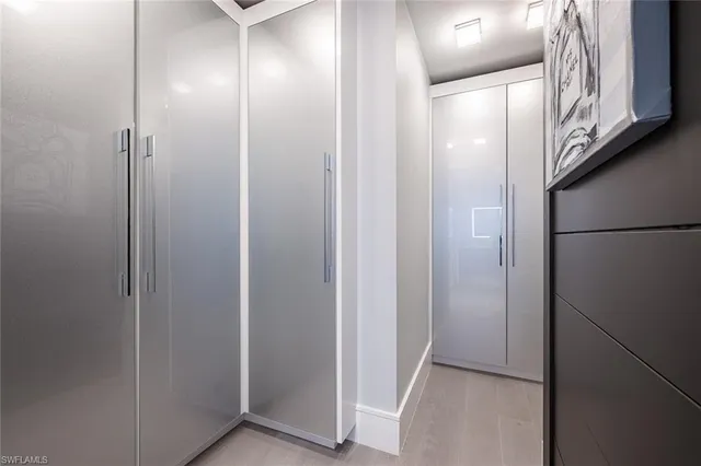 a spacious bedroom with a bed and a couch