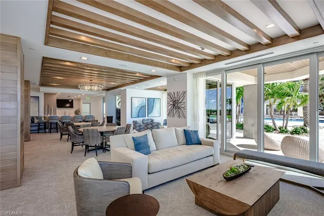 a large kitchen with a table and chairs