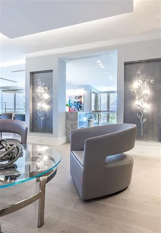 a living room with furniture and wall painting