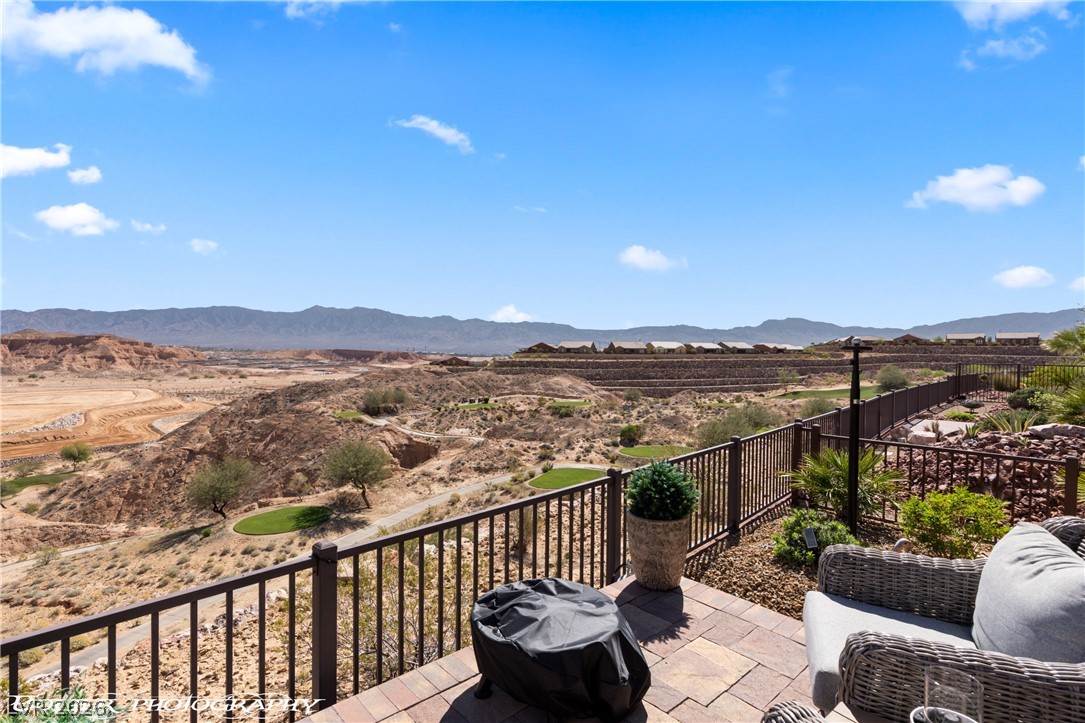 1262 Serenity Ridge Court Mesquite, NV 89034 - Photo 14 of 74 Balcony featuring a grill and a mountain view