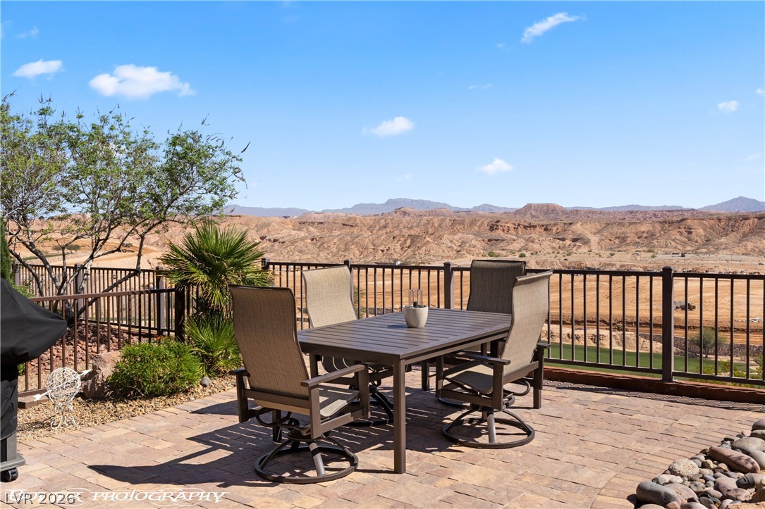 1262 Serenity Ridge Court Mesquite, NV 89034 - Photo 17 of 74 View of patio featuring outdoor dining area and a mountain view