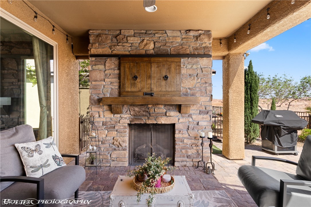 1262 Serenity Ridge Court Mesquite, NV 89034 - Photo 19 of 74 View of patio / terrace featuring area for grilling and an outdoor living space with a fireplace