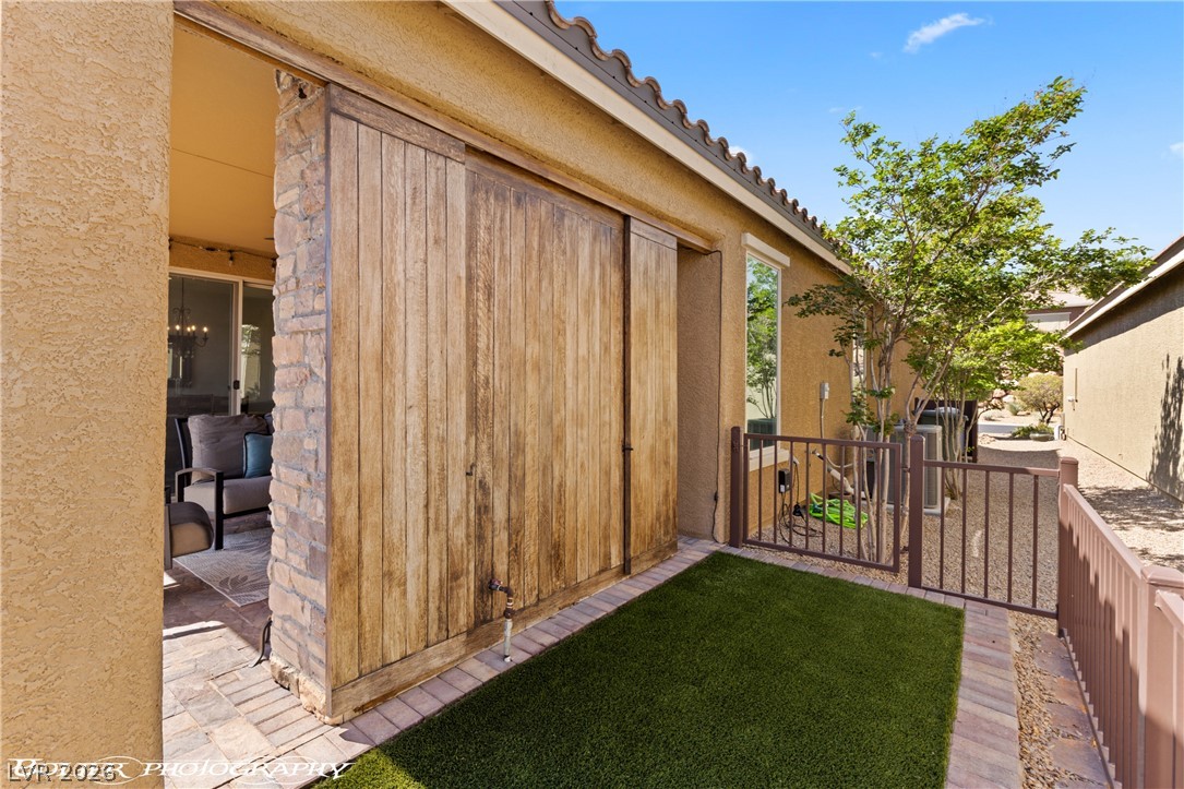 1262 Serenity Ridge Court Mesquite, NV 89034 - Photo 26 of 74 North baack side of outdoor fireplace- storage and privacy sliders