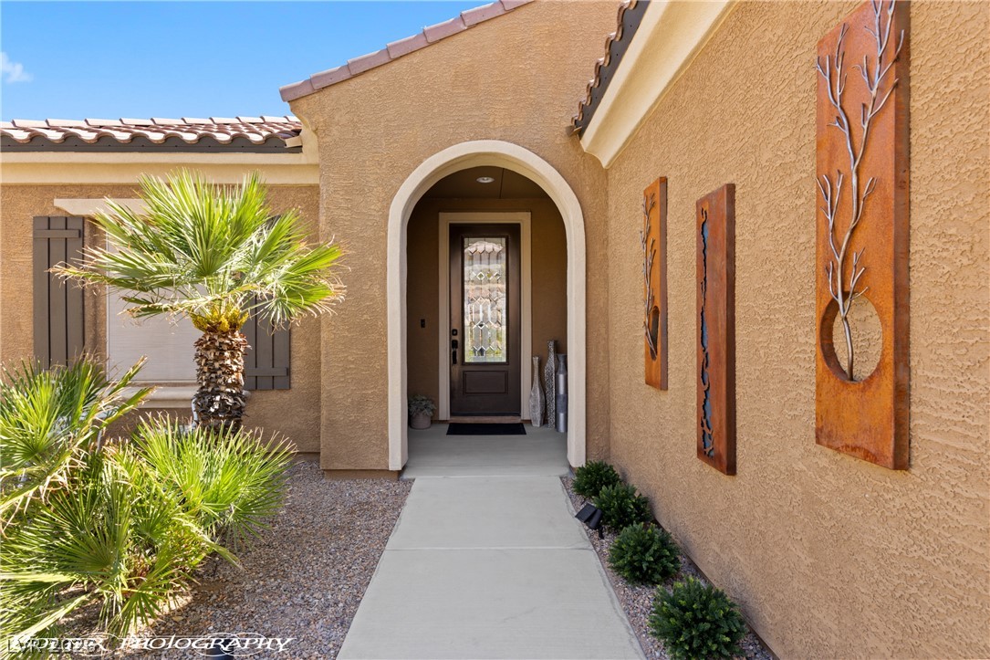 1262 Serenity Ridge Court Mesquite, NV 89034 - Photo 29 of 74 Entrance to property featuring a tile roof and stucco siding