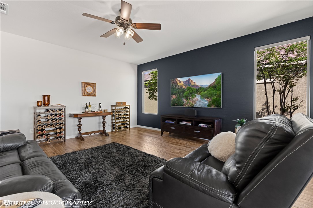 1262 Serenity Ridge Court Mesquite, NV 89034 - Photo 37 of 74 Living room with wood finished floors and a ceiling fan