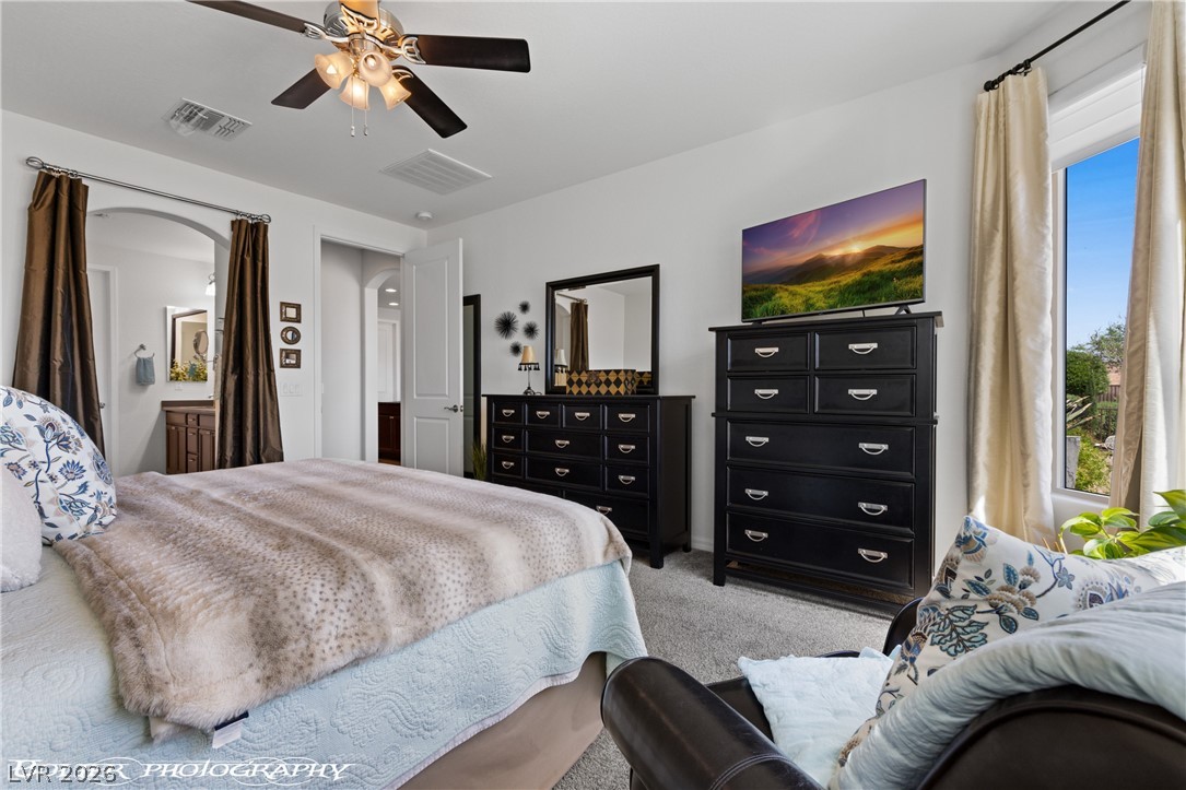 1262 Serenity Ridge Court Mesquite, NV 89034 - Photo 55 of 74 Bedroom with light carpet and a ceiling fan