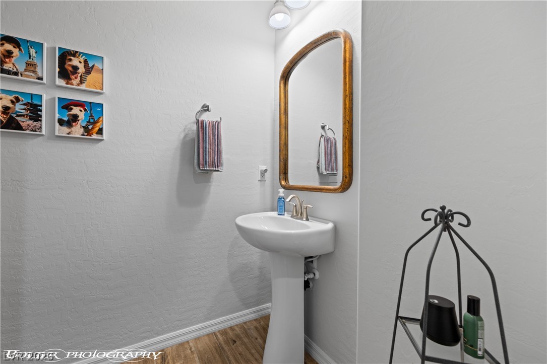 1262 Serenity Ridge Court Mesquite, NV 89034 - Photo 60 of 74 Bathroom with a textured wall and wood finished floors