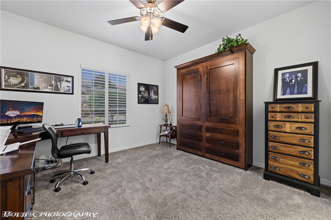 1262 Serenity Ridge Court Mesquite, NV 89034 - Photo 61 of 74 Home office featuring light colored carpet and a ceiling fan