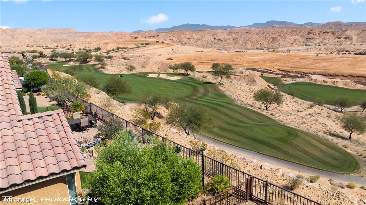 1262 Serenity Ridge Court Mesquite, NV 89034 - Photo 8 of 74 Drone / aerial view of a golf club and a mountain backdrop