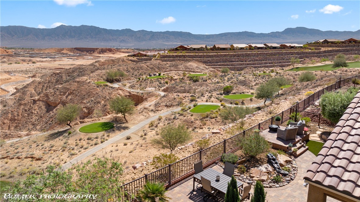 1262 Serenity Ridge Court Mesquite, NV 89034 - Photo 10 of 74 Drone / aerial view of a mountainous background and a desert landscape