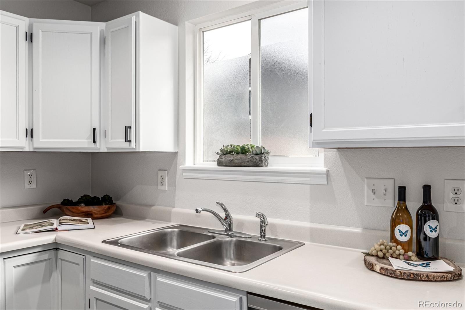 3705 Bucknell Circle Highlands Ranch, CO 80129 - Photo 12 of 42 a kitchen with a sink and cabinets