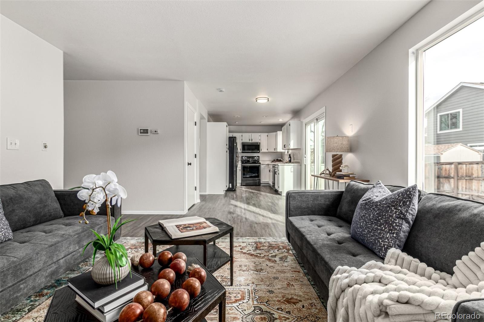 3705 Bucknell Circle Highlands Ranch, CO 80129 - Photo 16 of 42 a living room with furniture and wooden floor