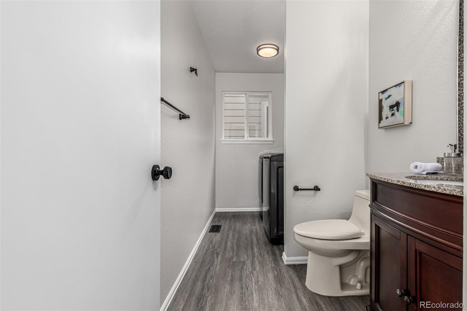 3705 Bucknell Circle Highlands Ranch, CO 80129 - Photo 17 of 42 a white toilet sitting next to a bathroom sink