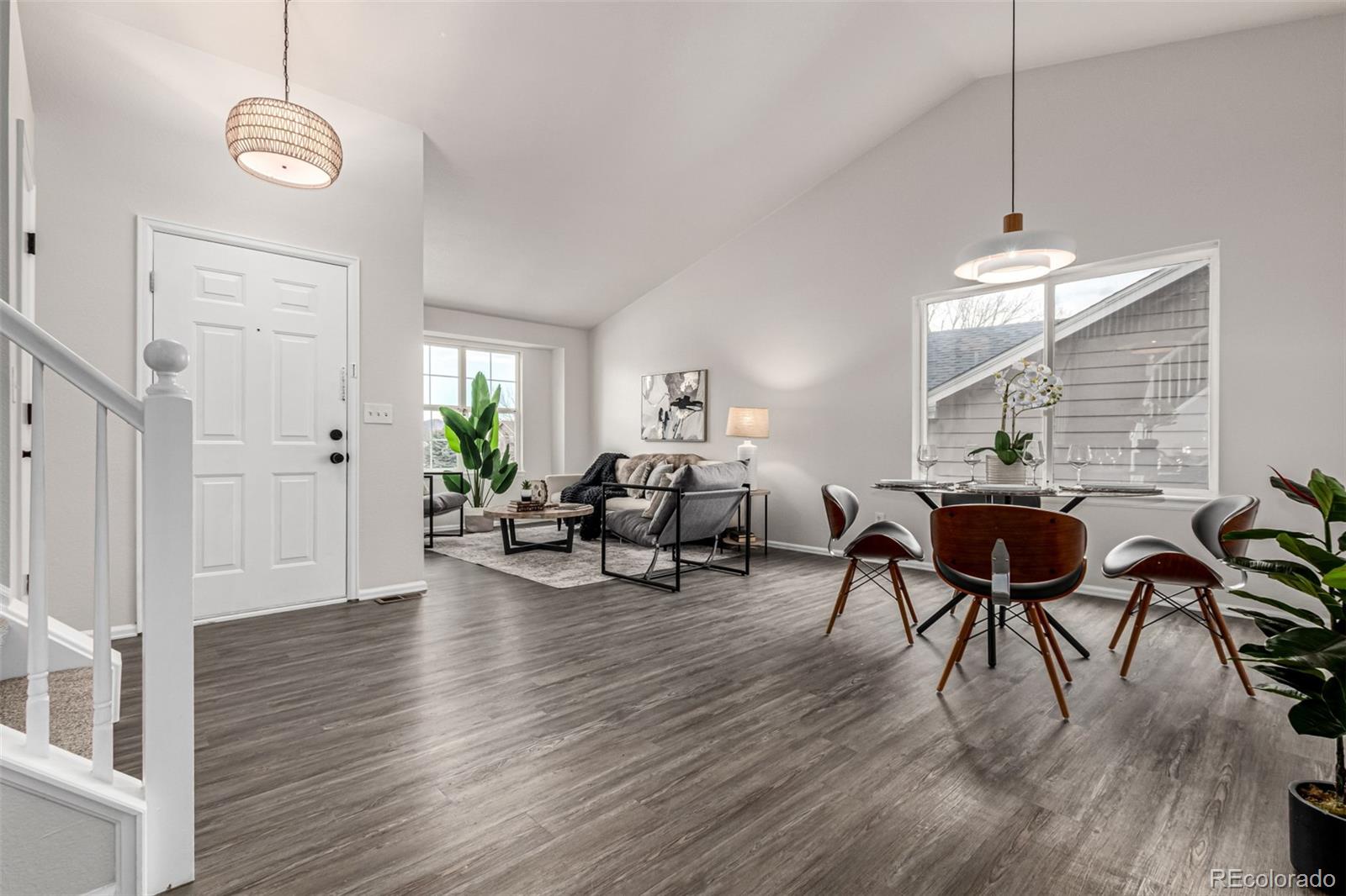3705 Bucknell Circle Highlands Ranch, CO 80129 - Photo 2 of 42 a view of a livingroom and dining room with furniture wooden floor a chandelier