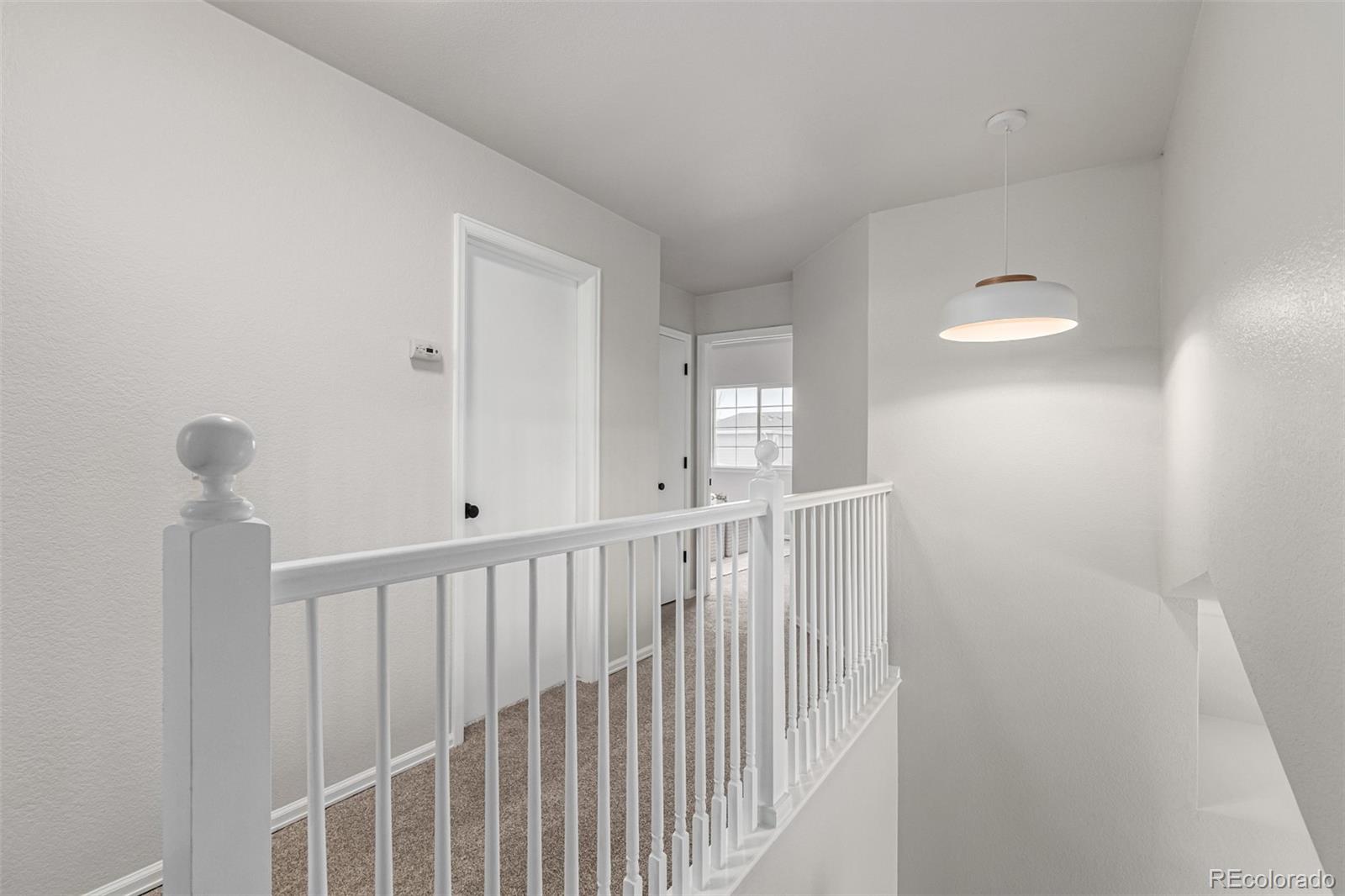 3705 Bucknell Circle Highlands Ranch, CO 80129 - Photo 24 of 42 a view of a hallway with windows