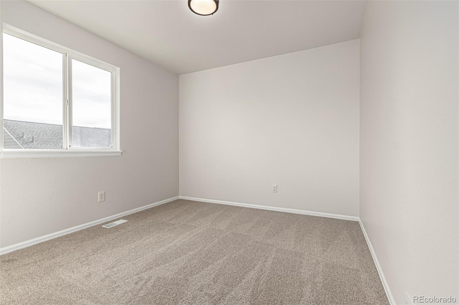 3705 Bucknell Circle Highlands Ranch, CO 80129 - Photo 28 of 42 an empty room with a window