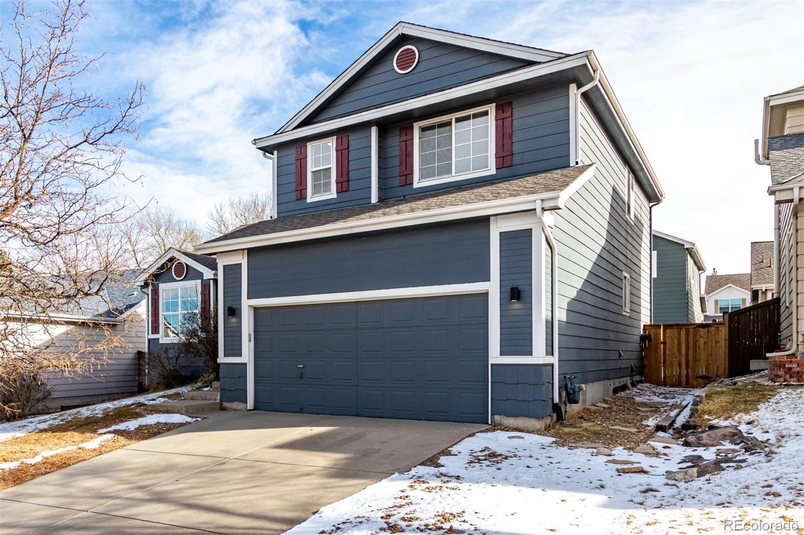 3705 Bucknell Circle Highlands Ranch, CO 80129 - Photo 37 of 42 a front view of a house with a yard