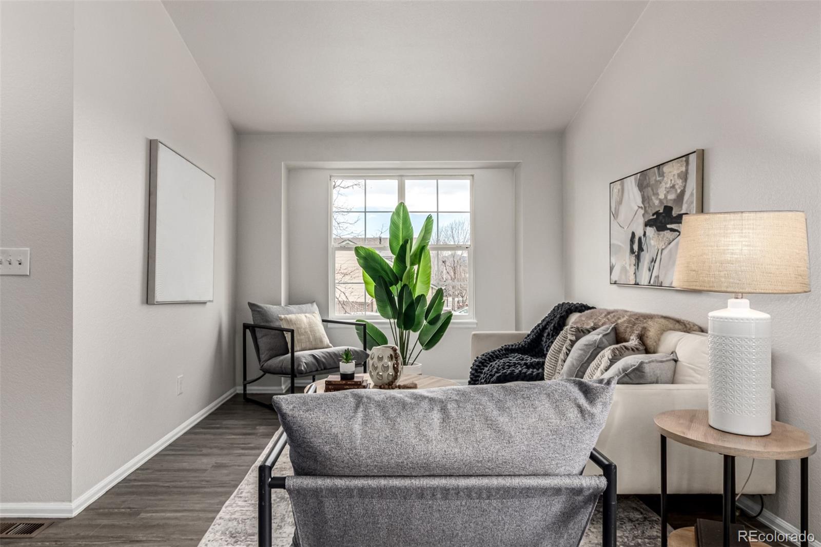 3705 Bucknell Circle Highlands Ranch, CO 80129 - Photo 4 of 42 a living room with furniture and a potted plant