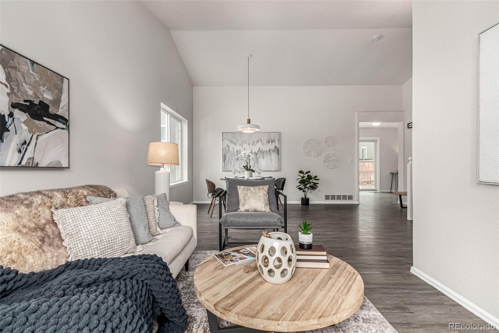 3705 Bucknell Circle Highlands Ranch, CO 80129 - Photo 6 of 42 a living room with furniture and a table