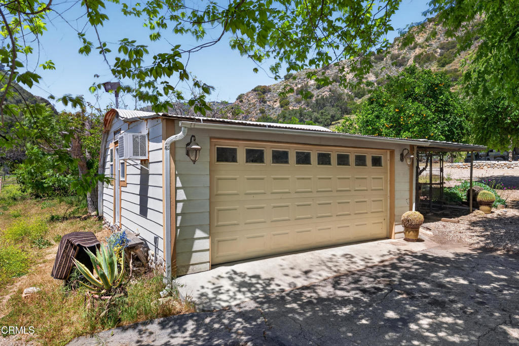 8416 Wheeler Canyon Road Santa Paula, CA 93060 - Photo 25 of 48 a house with a tree in the background