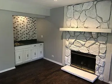 a living room with a fireplace