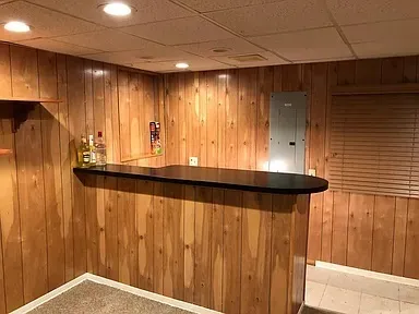 a kitchen with kitchen island a sink a refrigerator and a stove