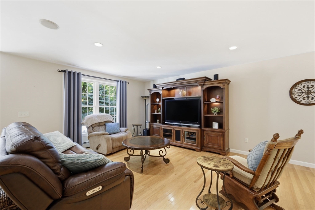 345 Bragg Road Warren, MA 01585 - Photo 11 of 41 a living room with furniture and a flat screen tv