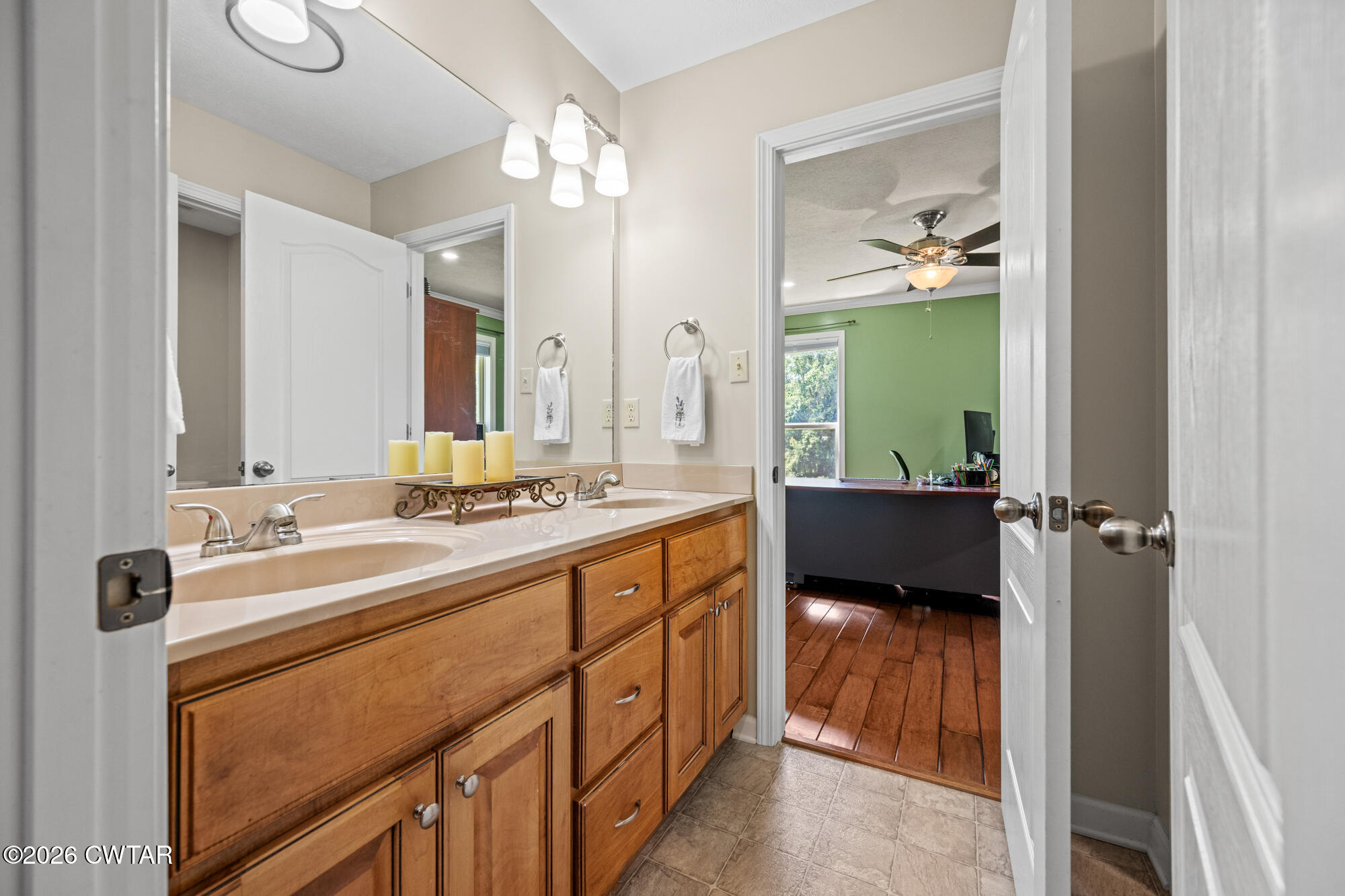 492 Joe Horton Road Lexington, TN 38351 - Photo 24 of 49 a en suite bathroom with a double vanity sink and mirror
