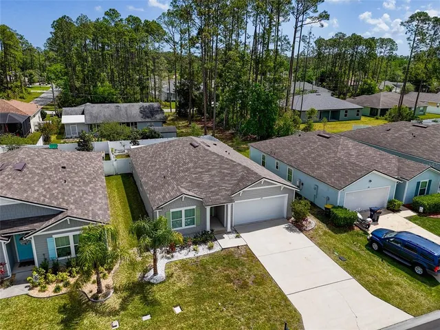 a aerial view of a house with garden