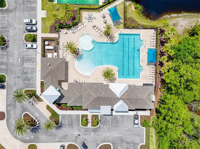 an aerial view of a house with a swimming pool