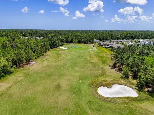 a view of a lake with a yard