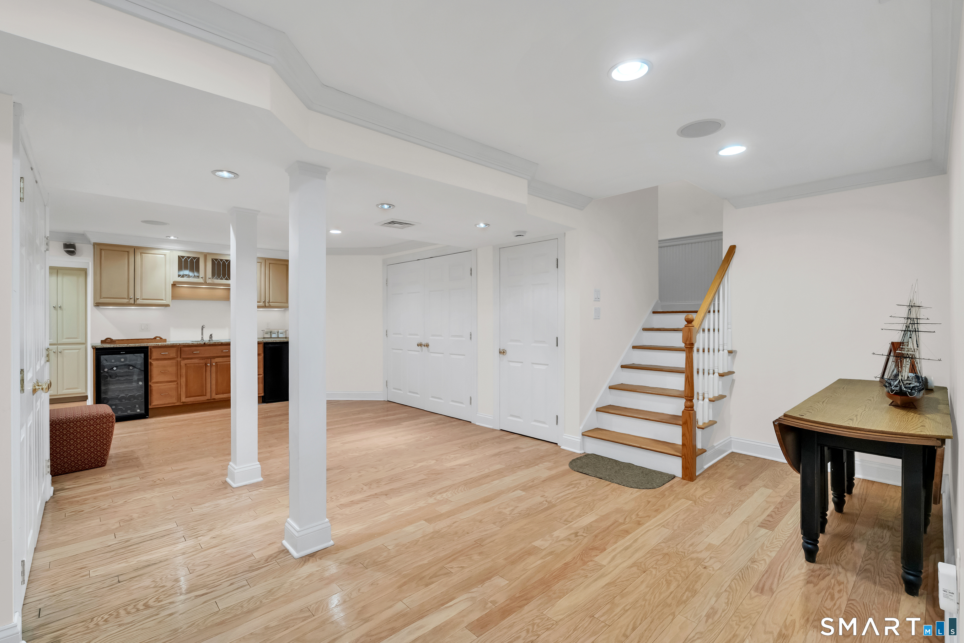 21 Stone Wall Road Salem, CT 06420 - Photo 28 of 38 a view of a livingroom with wooden floor and staircase