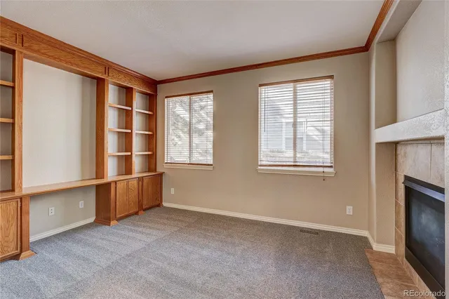 a living room with a fireplace and a couch