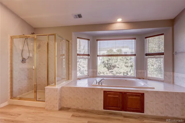 a bathroom with a sink double vanity granite and a large mirror