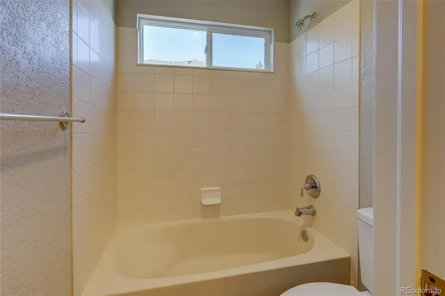 a bathroom with a sink toilet a shower and a mirror
