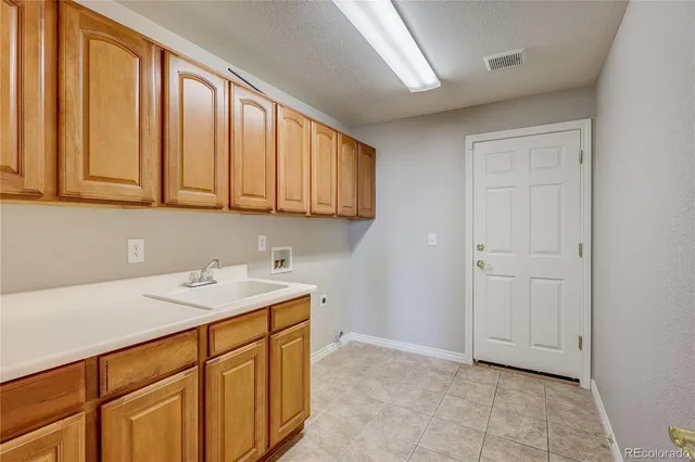 a view of empty room with wooden ceiling