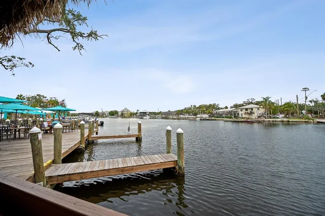 a view of a lake with a table and chairs