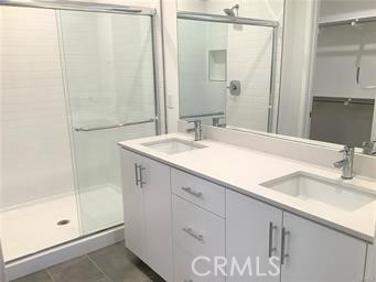 315 Placemark Irvine, CA 92614 - Photo 14 of 23 a bathroom with a sink and a mirror