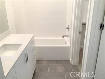 315 Placemark Irvine, CA 92614 - Photo 19 of 23 a bathroom with a bathtub and a shower