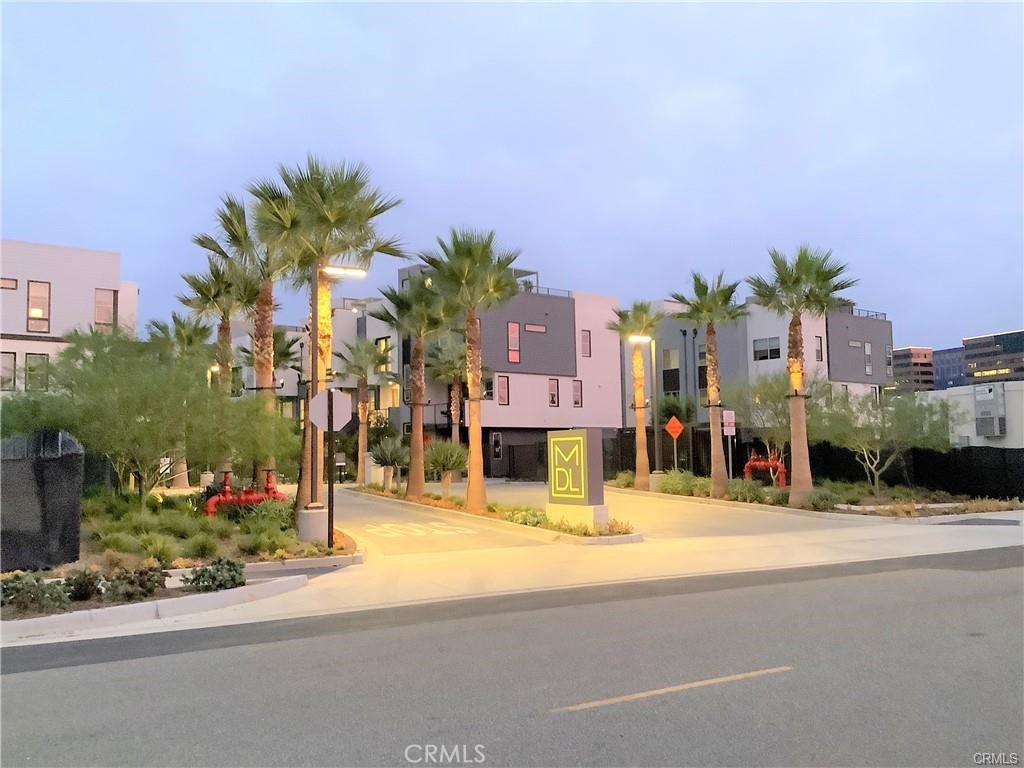 315 Placemark Irvine, CA 92614 - Photo 3 of 23 a view of a street with a building and palm trees