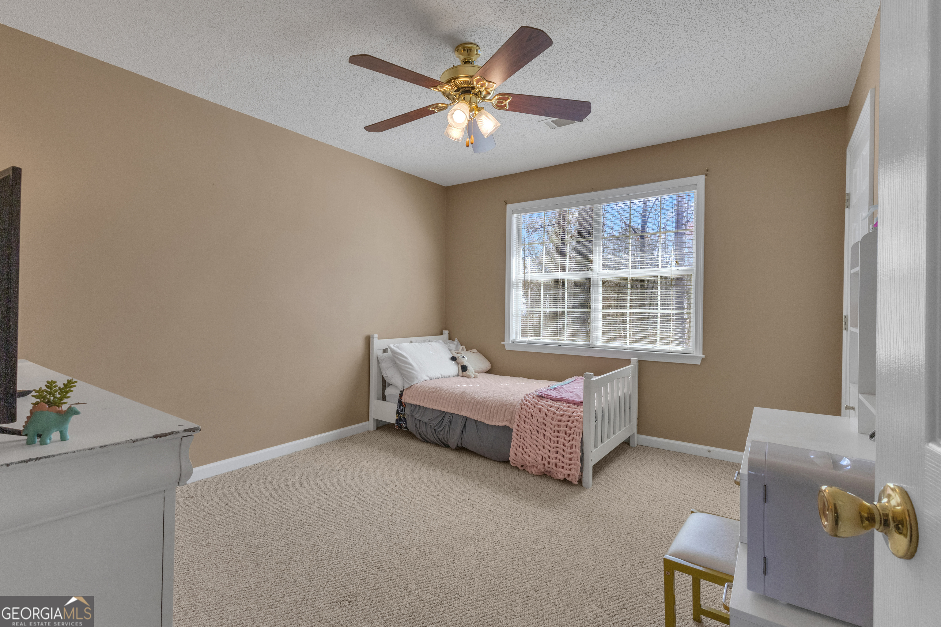 918 Scarletts Walk Locust Grove, GA 30248 - Photo 20 of 46 a bedroom with furniture and a window