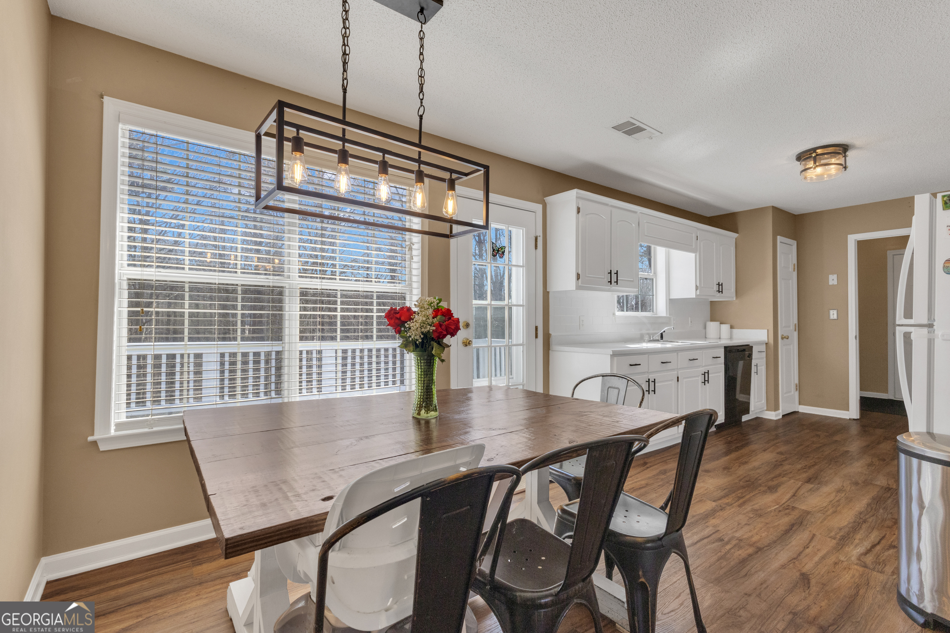 918 Scarletts Walk Locust Grove, GA 30248 - Photo 22 of 46 a dining room with furniture and window