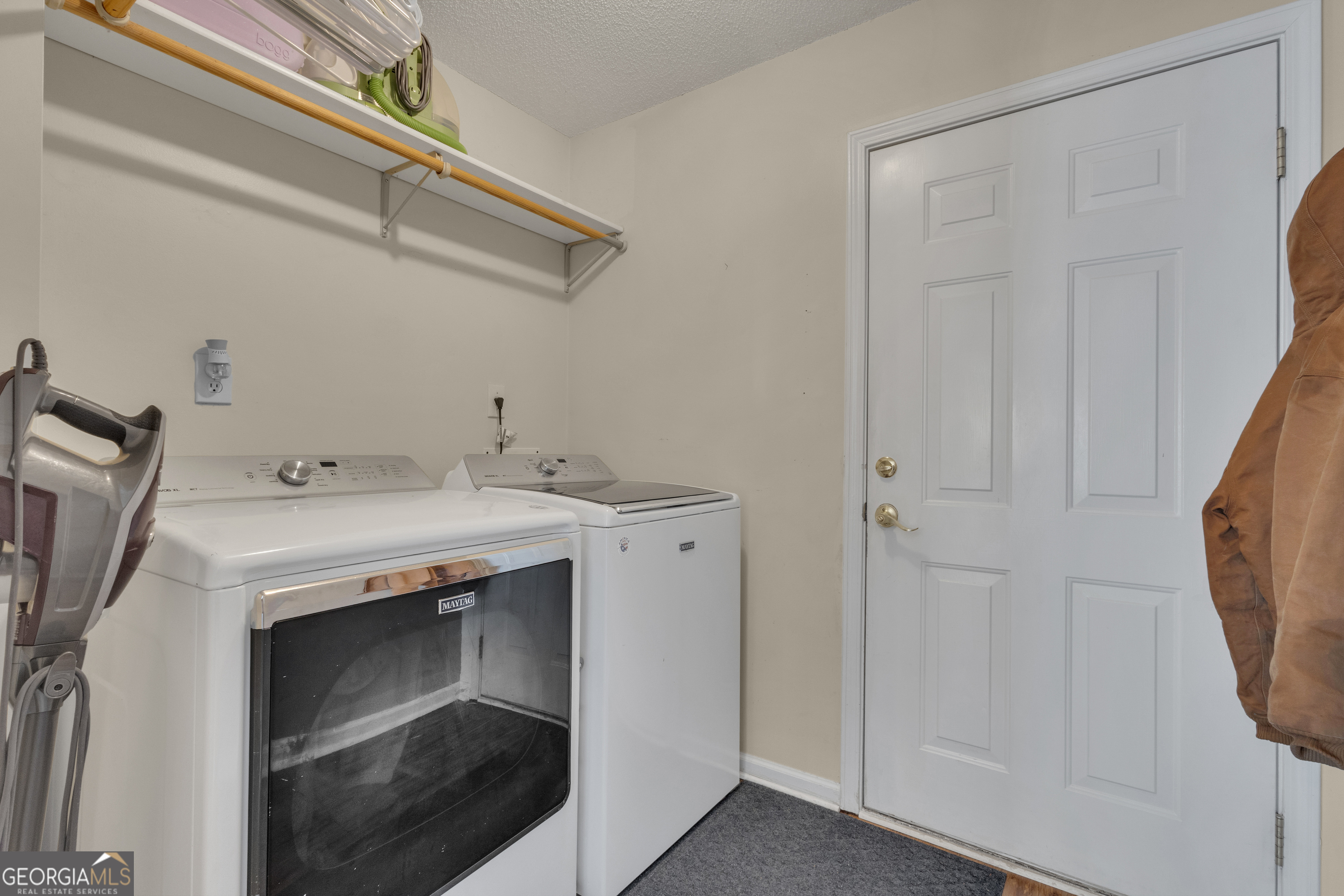 918 Scarletts Walk Locust Grove, GA 30248 - Photo 27 of 46 a utility room with a washer and dryer