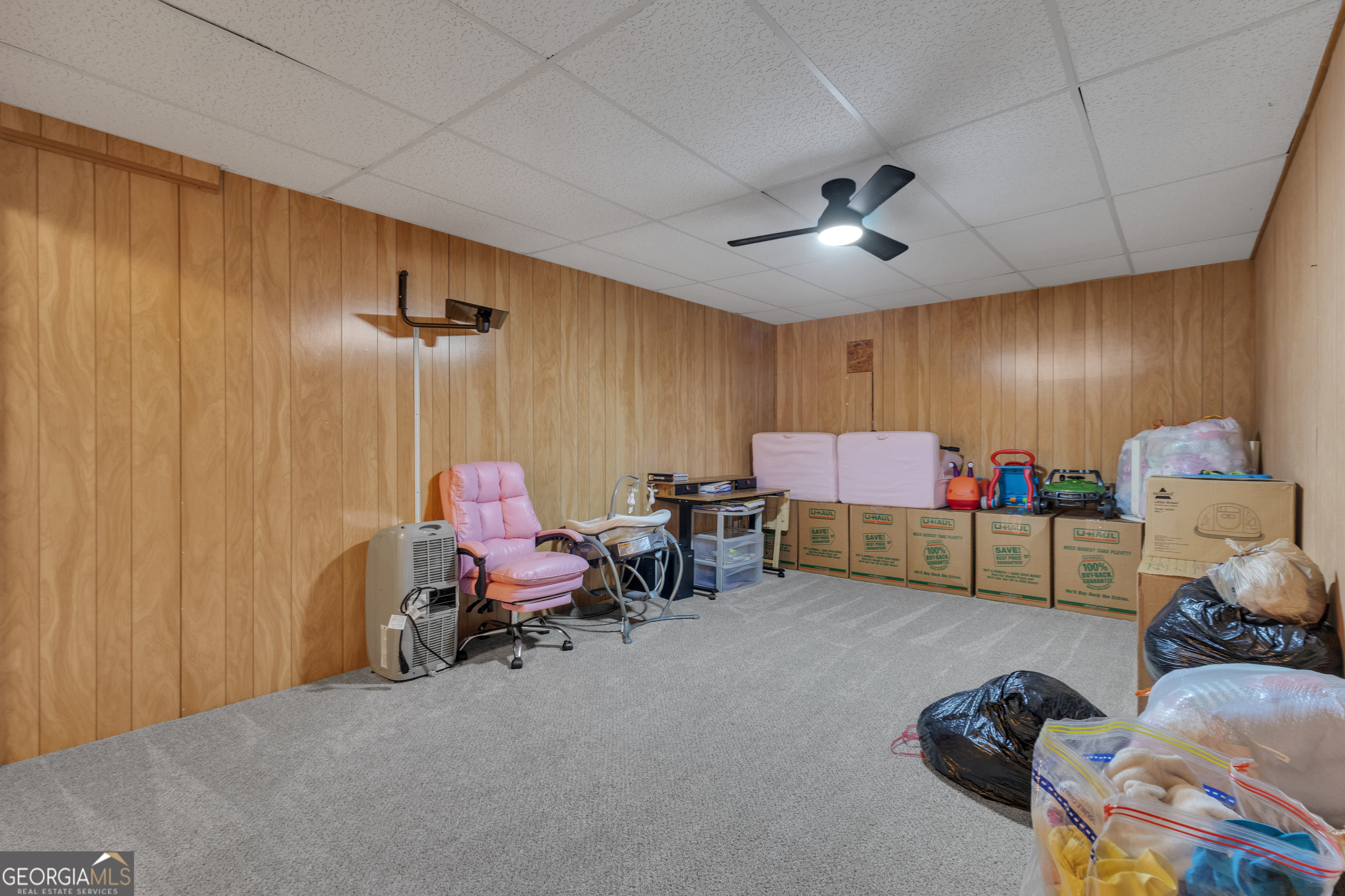 918 Scarletts Walk Locust Grove, GA 30248 - Photo 30 of 46 a bedroom with furniture and a chandelier fan