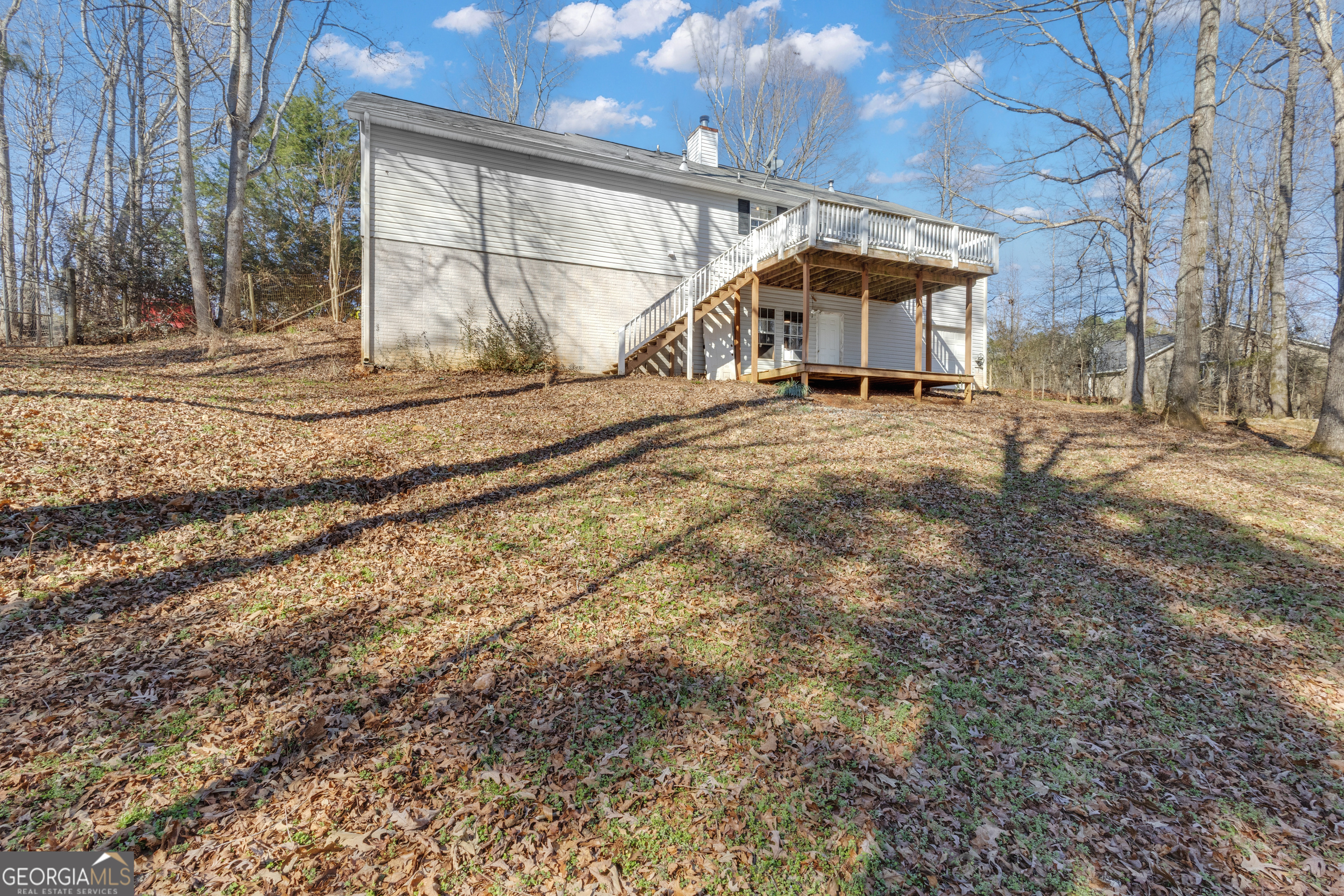 918 Scarletts Walk Locust Grove, GA 30248 - Photo 42 of 46 a view of a house with a yard