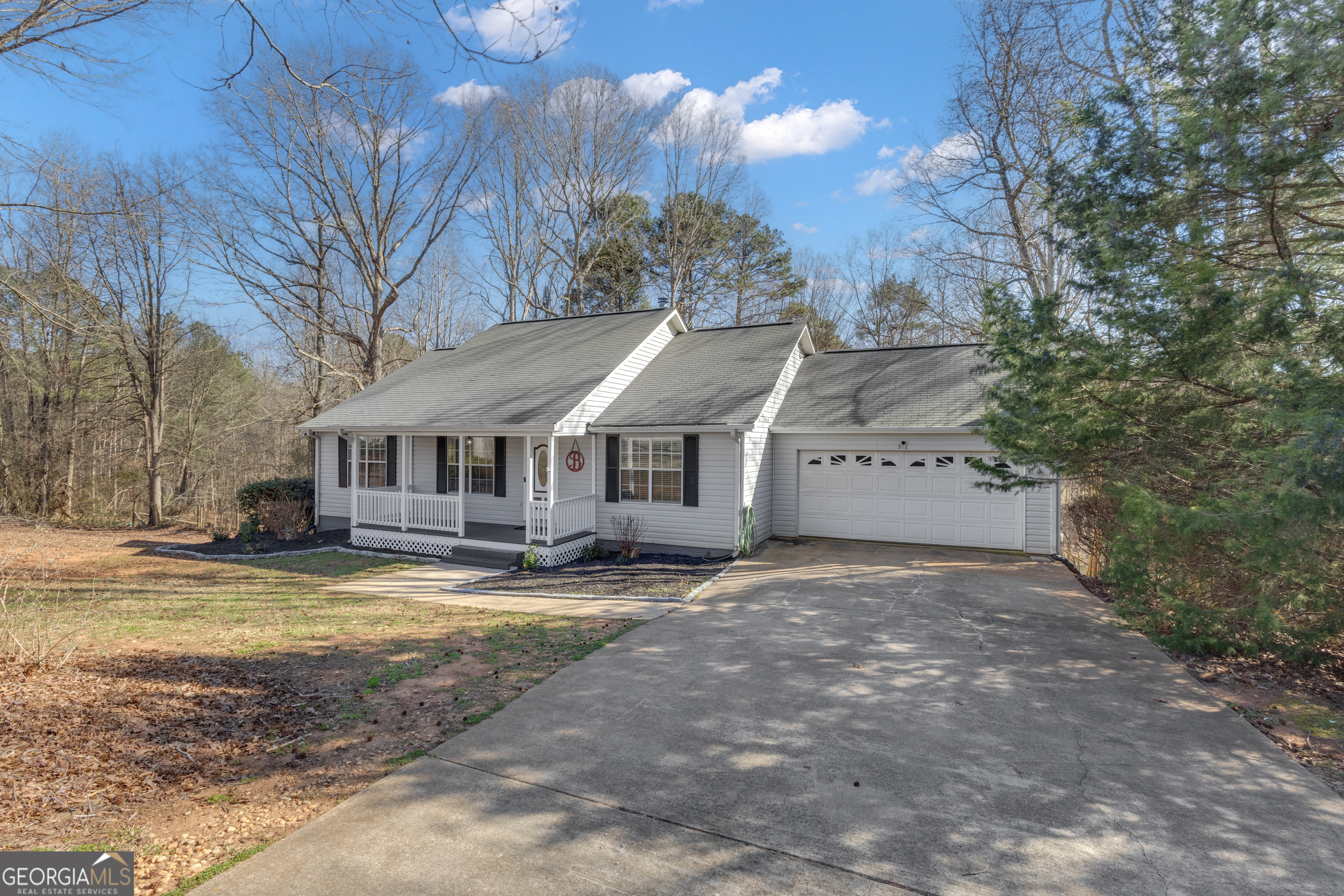 918 Scarletts Walk Locust Grove, GA 30248 - Photo 43 of 46 a view of a house with a yard covered in snow